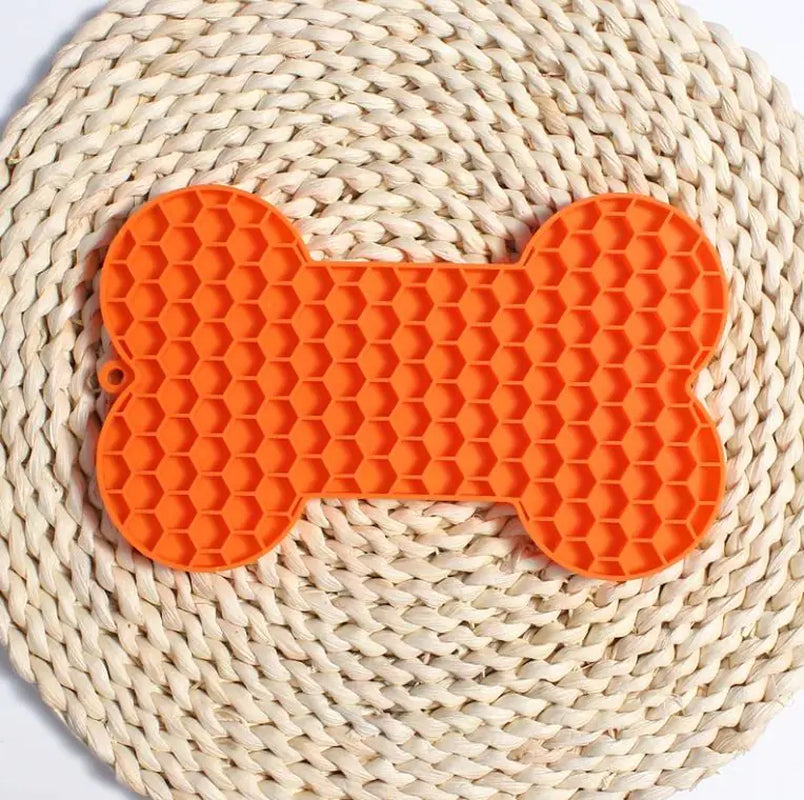 Orange bone-shaped silicone lick mat