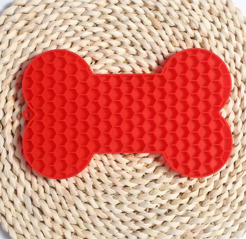 Red bone-shaped silicone lick mat