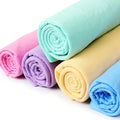 PVA pet towels rolled up in five colours