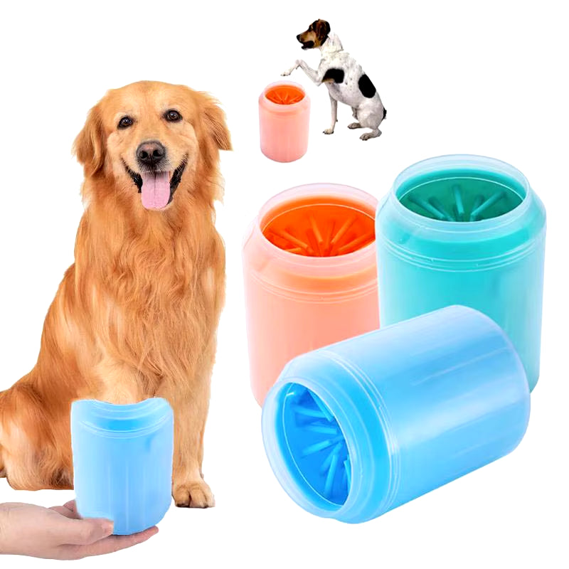 Golden retriever next to paw cleaner cups in blue, green and orange